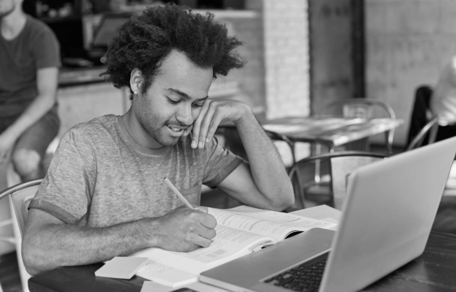 International students collaborating on budget planning exercises in modern learning environment