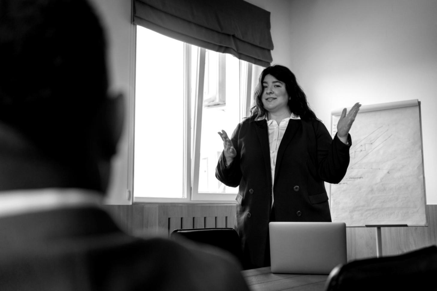 Modern office environment with professionals reviewing financial documents